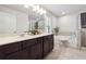 Elegant bathroom with double vanity, soaking tub, and walk-in shower at 3948 Lake Manor Way, Atlanta, GA 30349