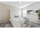Bedroom with textured wallpaper and comfy bed at 3948 Lake Manor Way, Atlanta, GA 30349