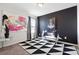 Bedroom with black accent wall, stylish rug, and comfy seating at 3948 Lake Manor Way, Atlanta, GA 30349