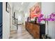 Bright entryway with hardwood floors, staircase, and decorative console table at 3948 Lake Manor Way, Atlanta, GA 30349