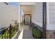 Front porch with gray door, stone accents, and two black chairs at 3948 Lake Manor Way, Atlanta, GA 30349
