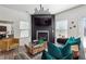 Living room with a modern fireplace, large TV, and comfortable seating at 3948 Lake Manor Way, Atlanta, GA 30349