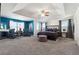 Spacious main bedroom with teal walls, plush seating, and large windows at 3948 Lake Manor Way, Atlanta, GA 30349