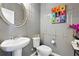 Stylish powder room with unique wall decor and pedestal sink at 3948 Lake Manor Way, Atlanta, GA 30349