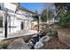 Modern backyard patio with pergola, water feature, and stone retaining walls at 1890 W Paces Ferry Nw Rd, Atlanta, GA 30327