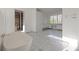 Elegant bathroom with freestanding tub and marble tile flooring at 1890 W Paces Ferry Nw Rd, Atlanta, GA 30327