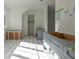 Bathroom with gray cabinets and marble tile floor at 1890 W Paces Ferry Nw Rd, Atlanta, GA 30327