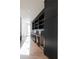 Modern butler's pantry with sleek dark cabinetry and marble countertops at 1890 W Paces Ferry Nw Rd, Atlanta, GA 30327