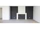 Modern fireplace with dark gray stone and white surround at 1890 W Paces Ferry Nw Rd, Atlanta, GA 30327