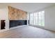 Living room with hardwood floors, modern fireplace and large windows at 1890 W Paces Ferry Nw Rd, Atlanta, GA 30327