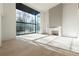 Sunlit living room boasts hardwood floors, a contemporary fireplace, and expansive windows at 1890 W Paces Ferry Nw Rd, Atlanta, GA 30327