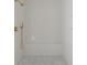 Walk-in shower with marble tile and gold fixtures at 1890 W Paces Ferry Nw Rd, Atlanta, GA 30327