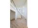 Grand curved staircase with glass railings and hardwood floors at 1890 W Paces Ferry Nw Rd, Atlanta, GA 30327