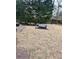 Large backyard with a bench and some trees at 25 Johnson Rd, Atlanta, GA 30318