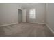 Bright bedroom with carpet flooring and a window at 509 Ajo Way, Dallas, GA 30157