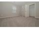 Spacious bedroom with carpet flooring and a large closet at 509 Ajo Way, Dallas, GA 30157