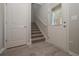 Bright entryway with staircase, storage closet, and exterior door at 509 Ajo Way, Dallas, GA 30157