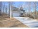 Two-story house with light beige siding, stone accents, and a driveway at 509 Ajo Way, Dallas, GA 30157