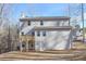 Rear view of house with deck and wooded lot at 509 Ajo Way, Dallas, GA 30157