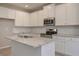 Modern kitchen with white cabinets and granite countertops at 509 Ajo Way, Dallas, GA 30157