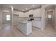 Modern kitchen with white cabinets and granite island at 509 Ajo Way, Dallas, GA 30157