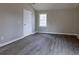 Bedroom with window and vinyl plank flooring at 8255 Stonebrook Dr, Cumming, GA 30040