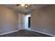 Well-lit bedroom with hardwood floors and a double door closet at 8255 Stonebrook Dr, Cumming, GA 30040