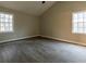 Spacious bedroom with vaulted ceiling and vinyl flooring at 8255 Stonebrook Dr, Cumming, GA 30040