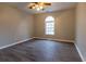 Spacious bedroom with hardwood floors, modern ceiling fan, and natural light at 8255 Stonebrook Dr, Cumming, GA 30040