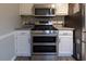 Stainless steel appliances and light gray countertops feature in this updated kitchen at 8255 Stonebrook Dr, Cumming, GA 30040