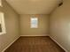 Simple bedroom with brown carpet and a window at 1851 Irwin Bridge Nw Rd, Conyers, GA 30012