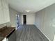 Dining area with gray vinyl flooring and access to kitchen at 1851 Irwin Bridge Nw Rd, Conyers, GA 30012