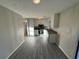 Kitchen with gray vinyl flooring and stainless steel appliances at 1851 Irwin Bridge Nw Rd, Conyers, GA 30012