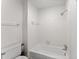 Clean bathroom with a shower/tub combo and white tile at 6520 Roswell Rd # 106, Atlanta, GA 30328