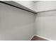 Walk-in closet with a hanging rod and a shelf at 6520 Roswell Rd # 106, Atlanta, GA 30328