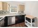 Kitchen features stainless steel dishwasher and microwave at 6520 Roswell Rd # 106, Atlanta, GA 30328