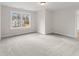 Bright bedroom featuring grey carpet and a large window at 2722 Byess Ct, Marietta, GA 30064