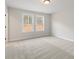 Spacious bedroom with gray carpeting and two windows at 2722 Byess Ct, Marietta, GA 30064