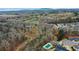 Community pool and surrounding landscape from above at 4960 Shade Creek Xing, Cumming, GA 30028