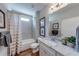 Bathroom with tub shower and granite vanity at 4960 Shade Creek Xing, Cumming, GA 30028