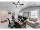 Bright home office with a desk, chair, and nearby bathroom at 4960 Shade Creek Xing, Cumming, GA 30028