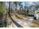 Large backyard with wooded area and concrete patio at 7270 Oswego Trl, Riverdale, GA 30296