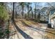 Spacious backyard with concrete patio and trees at 7270 Oswego Trl, Riverdale, GA 30296