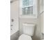 Clean bathroom with white toilet and bathtub at 7270 Oswego Trl, Riverdale, GA 30296