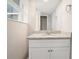 Bathroom with granite countertop vanity and white cabinets at 7270 Oswego Trl, Riverdale, GA 30296