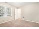 Cozy bedroom with neutral walls and carpet flooring at 7270 Oswego Trl, Riverdale, GA 30296