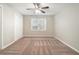 Bedroom with neutral walls, ceiling fan, and new carpet at 7270 Oswego Trl, Riverdale, GA 30296