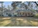 Gray house with wooden front porch at 7270 Oswego Trl, Riverdale, GA 30296