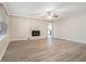 Living room with stone fireplace and hardwood floors at 7270 Oswego Trl, Riverdale, GA 30296