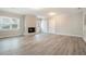 Bright living room featuring a fireplace and wood-look floors at 7270 Oswego Trl, Riverdale, GA 30296